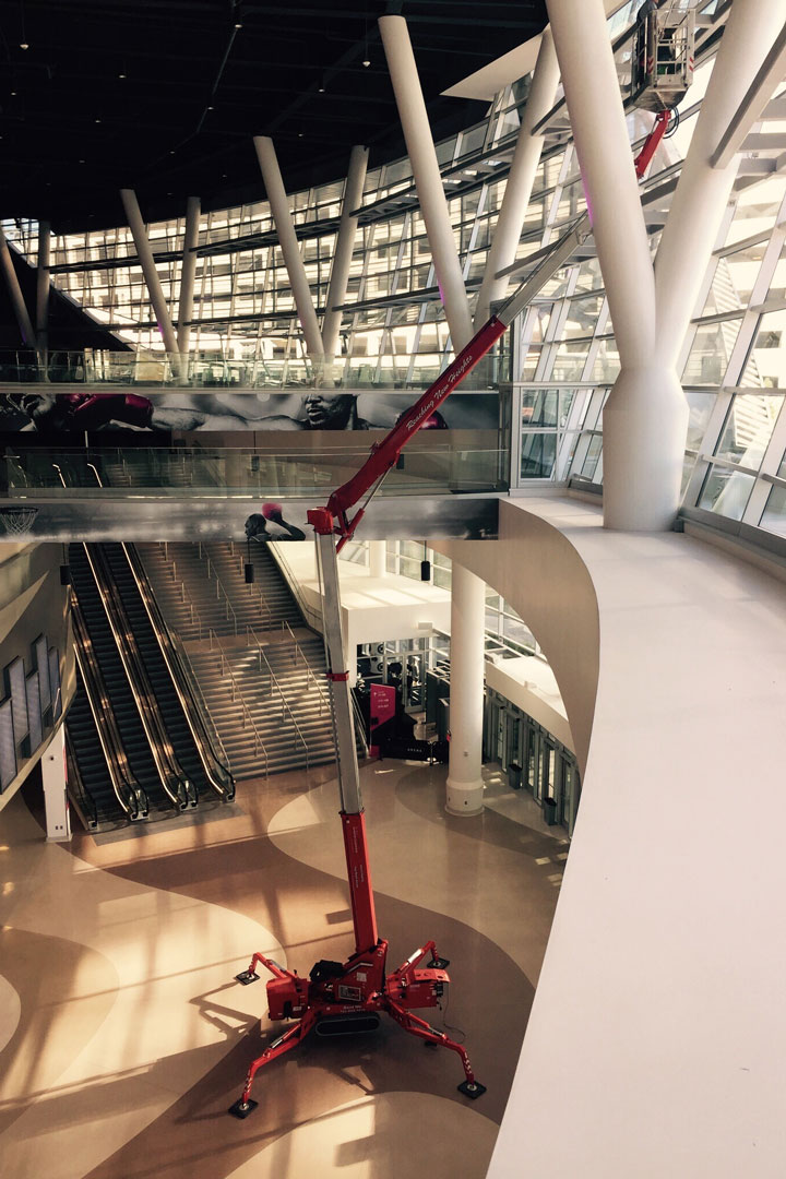 A tall building that can be cleaned using an atrium lift to clean high-rise windows 