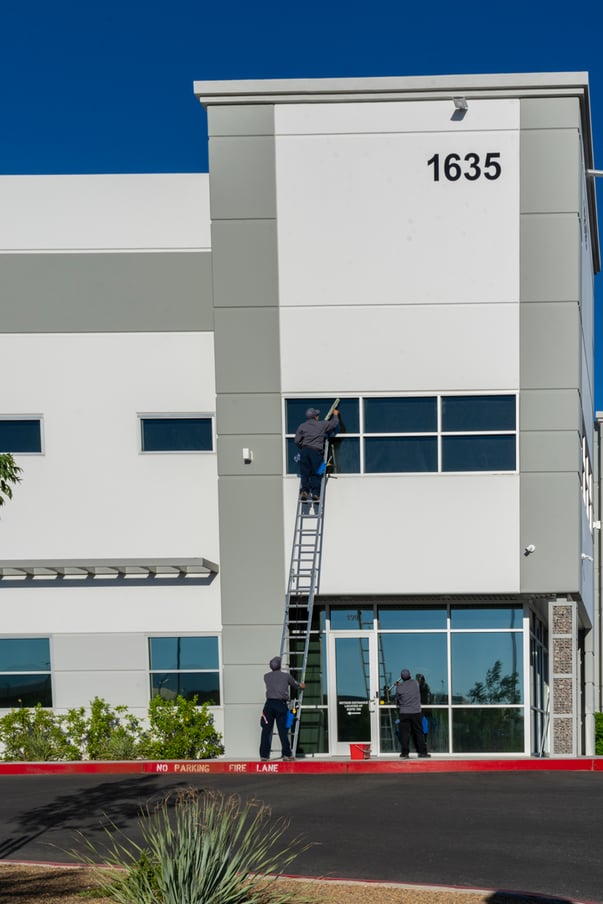 Red Rock Property services team using an atrium lift to clean windows for Family Courts and Services Center in Las Vegas, Nevada